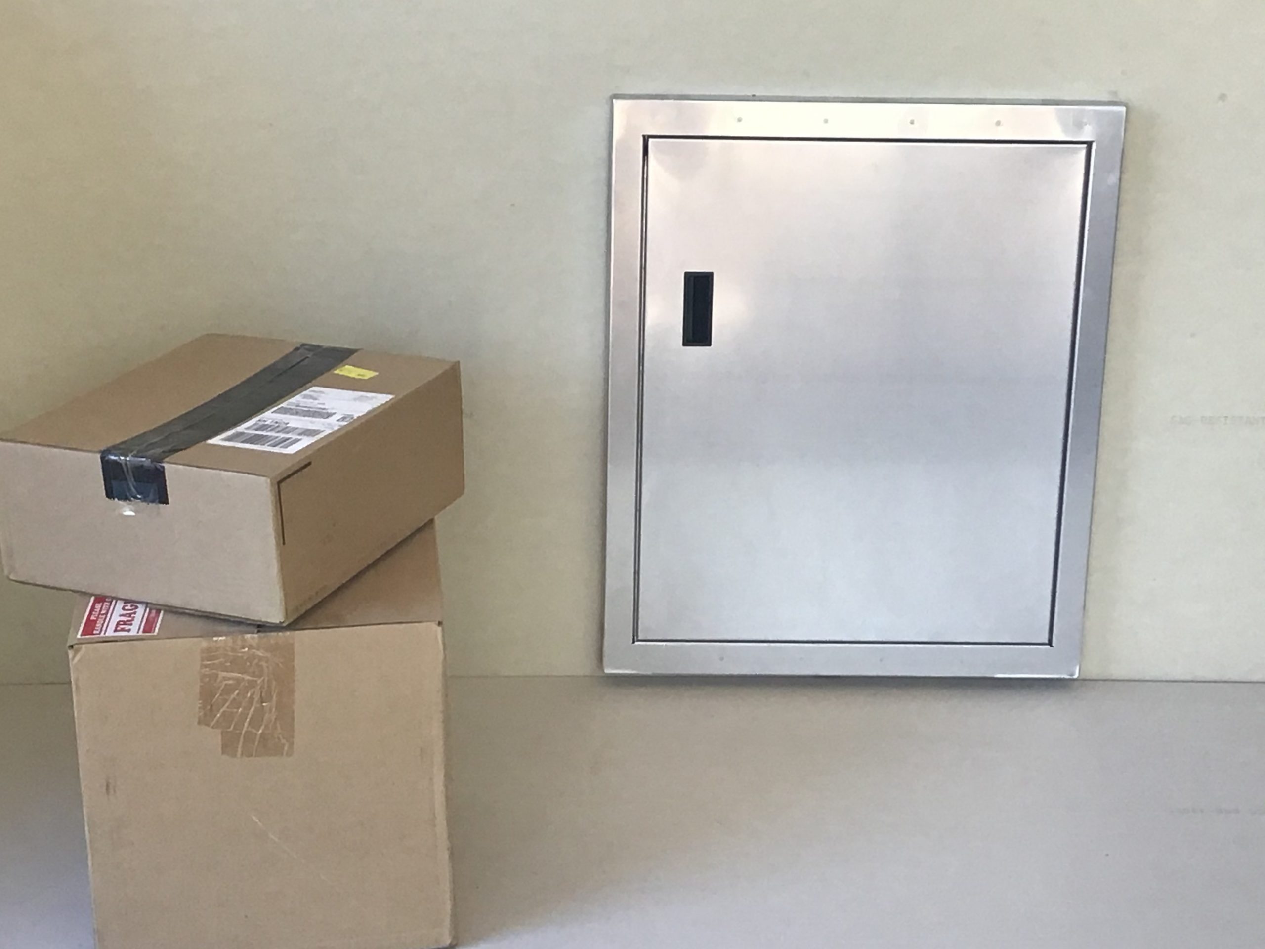 Aluminum Guardian Dropbox beside delivered packages